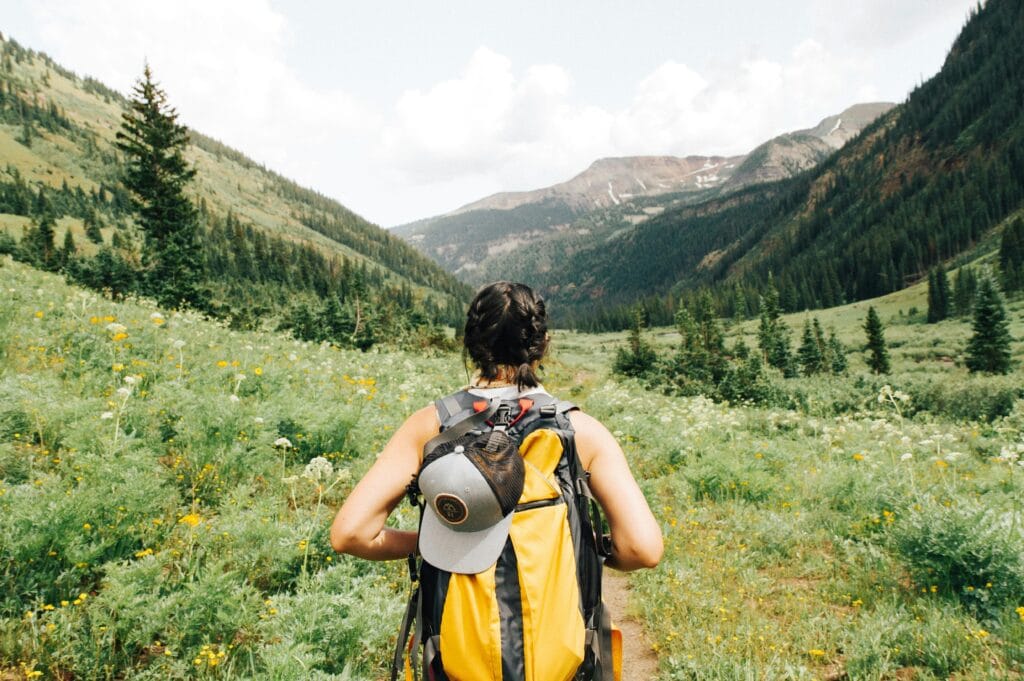 Hiking woman in valley