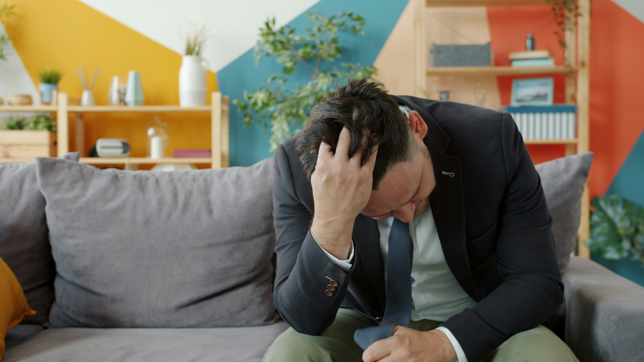 Sitting Tired on Couch