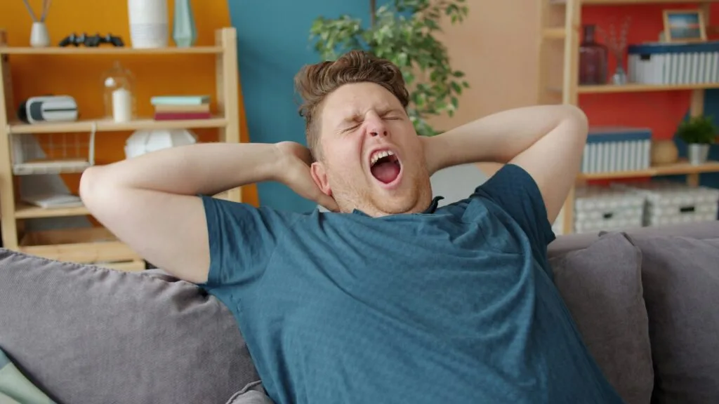 Yawning man on couch